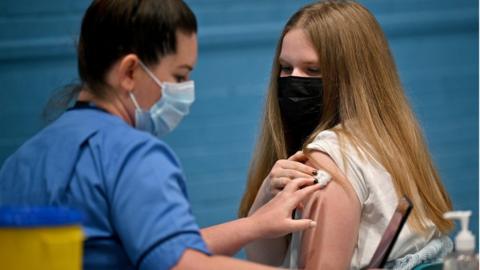 teenager getting a vaccine