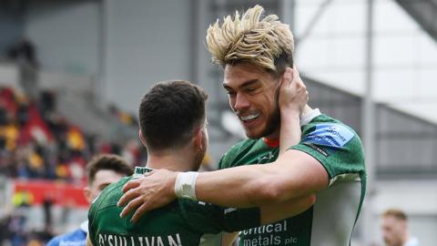 London Irish's Hugh O'Sullivan (L) celebrates his opening try with Ollie Hassell-Collins