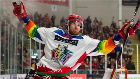 Former Cardiff Devils player Mike McNamee celebrates a goal on Pride Night