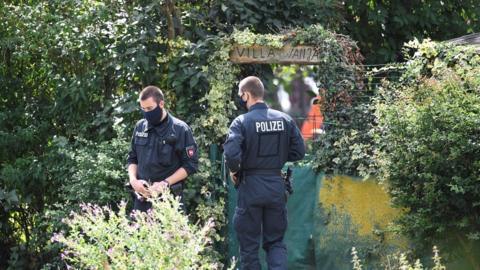 Police works at the site where they started digging in an allotment area near Hanover, Germany July 29, 2020