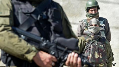 Indian paramilitary troops stand guard at the hospital in Srinagar