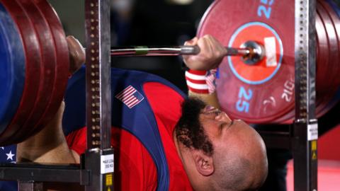 American powerlifter Antonio Deandre Martin prepares to lift the bar