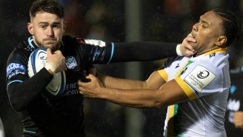 Warriors' Ollie SMith and Northampton's Tarek Haffar