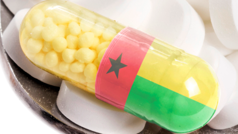 A stock image showing a drug capsule with the colours of Guinea-Bissau's flag