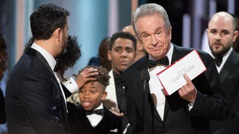 Actor Warren Beatty holding up the card that showed they had announced the wrong winner