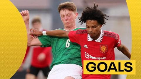 Northern Ireland and Manchester United Under-18 players tussle for the ball