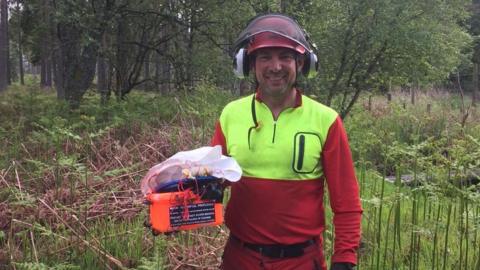 Member of Aberdeen Mountain Rescue Team and the rescued balloon