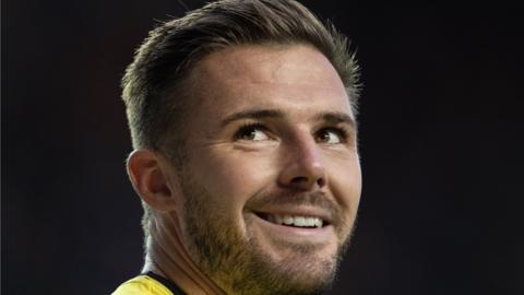 Jack Butland smiles while playing for Rangers