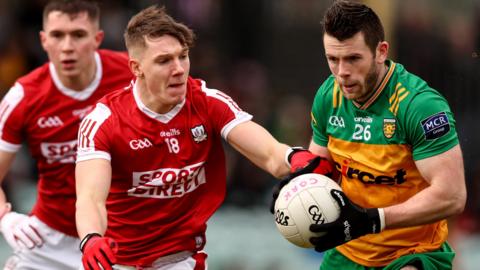 Eoghan Ban Gallagher attempts to get past Cork's Darragh Cashman at MacCumhaill Park