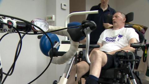 David Collings sitting on a motorised bike