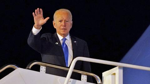 US President Joe Biden waves from Air Force One as he departs Edinburgh