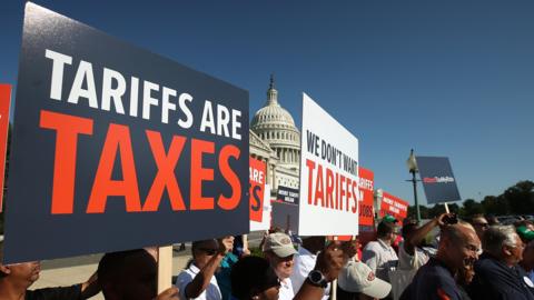 Auto workers rally against U.S. President Donald Trump"s proposed tariffs on auto imports and the impact on auto makers and their surrounding communities, during a news conference on Capitol Hill, on July 19, 2018 in Washington, DC.