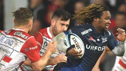 Marland Yarde races away from the Gloucester defence to score a try for Sale Sharks