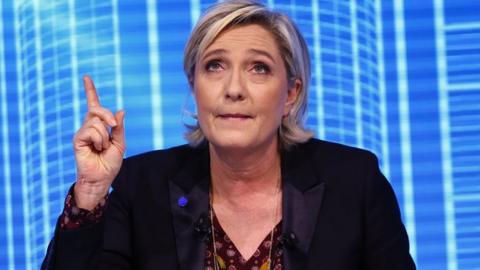 Marine Le Pen looking skyward