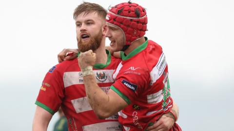 Harri Doel of Llandovery celebrates the win over Merthyr with Griff Evans