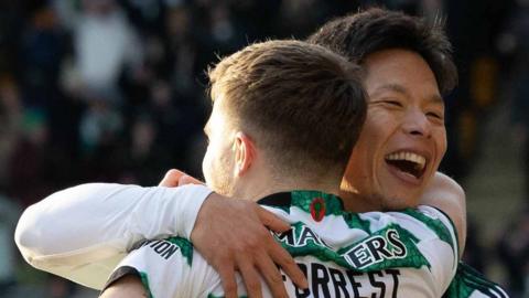 Celtic players James Forrest and Tomoki Iwata