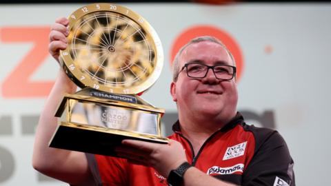 Stephen Bunting celebrates winning the 2024 PDC Cazoo Masters Darts Final at Marshall Arena in Milton Keynes