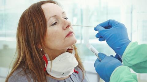 Woman being tested for the virus using a swab test