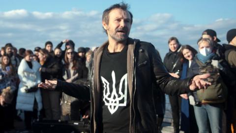 An impromptu open-air concert of the Okean Elzy rock band on the pedestrian and cycling bridge across Volodymyrskyi Descent, Kyiv