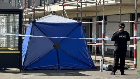 forensic tent outside the Palace Hotel