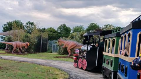 The train driver job at Hamerton Zoo will entail riding though the dinosaur park
