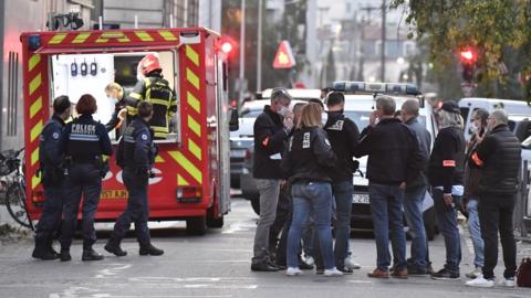 Security and emergency personnel are on October 31, 2020 in Lyon at the scene where an attacker armed with a sawn-off shotgun wounded an Orthodox priest