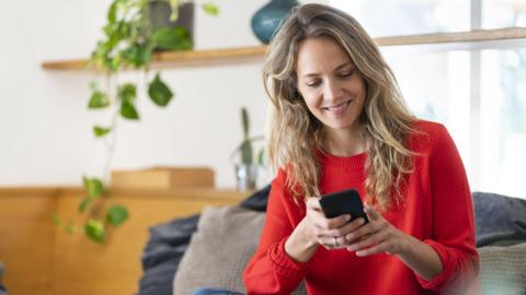 Young woman looking at her phone