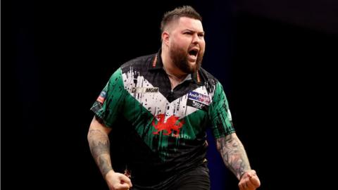 Michael Smith celebrates