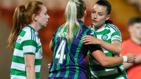 Celtic and Hibernian players embrace