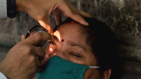 A woman having an eye examination at a hospital in Mumbai.