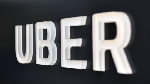 The Uber logo is seen outside the Uber Corporate Headquarters building in San Francisco, California on February 05, 2018