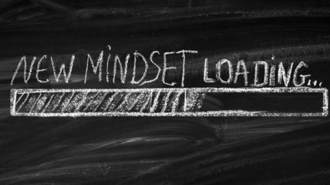 Blackboard with New Mindset Loading written across it