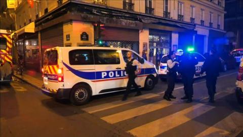 French police seal off the scene of the attack in Paris