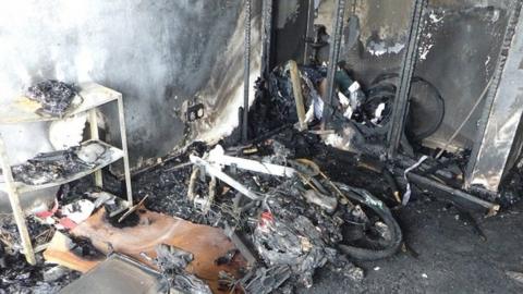 The remains of an e-bike which had caught fire