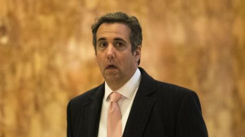 Michael Cohen walks in Trump Tower.