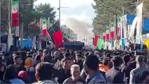 Crowd flees after double bomb blast near Iran general Qasem Soleimani's tomb in Kerman.