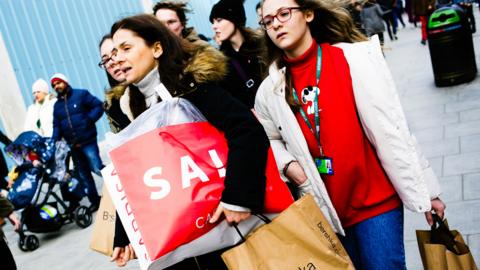 Shoppers carrying bags