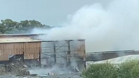 A burning industrial building