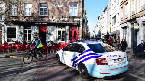 A police car blocks access to the Meir, Antwerp's main pedestrian street, after a man was arrested after he tried to drive into a crowd of shoppers at high speed on the street, on 23 March 2017, in Antwerp, Belgium