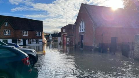 A picture of Marlborough town centre showing cars and flood water