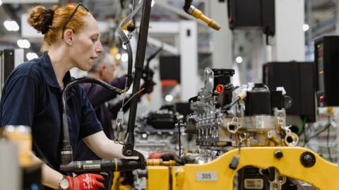 A woman at a JLR plant in England