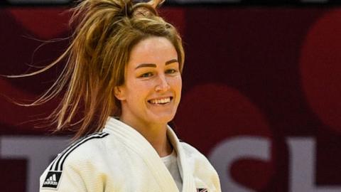 Amy Livesey celebrates beating Gankhaich Bold to win bronze in the women's -63kg category at judo's Tashkent Grand Slam in March 2021