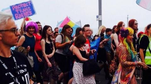 Trans Pride marchers make their way through the streets of Brighton