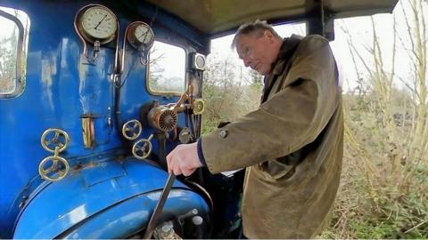 Adrian Shooter in the cab of a steam train