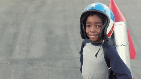 Boy with rocket on his back