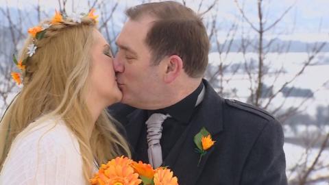 Cameron Watt kisses his bride