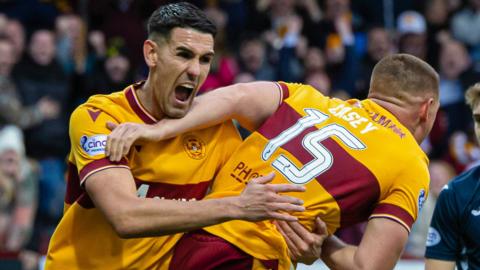 Motherwell's Connor Wilkinson (L) and Dan Casey celebrate after Max Ross scores to make it 3-3 during a cinch Premiership match between Motherwell and Ross County at Fir Park