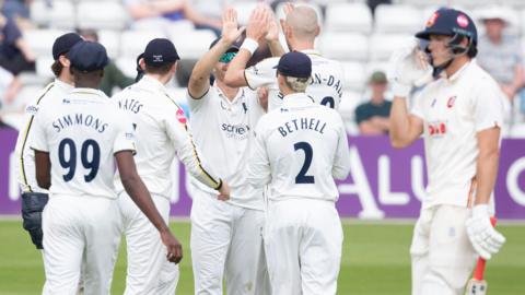Warwickshire celebrate taking wicket
