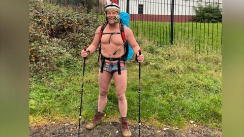 John wore a Roman helmet and his best pair of trunks to take on the 73-mile Hadrian's Wall.