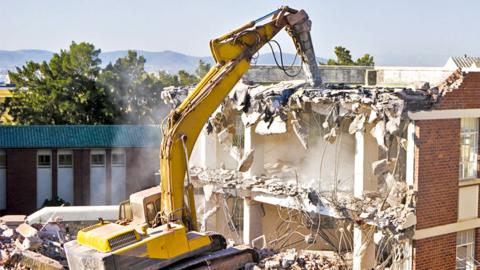Stock image of a building being demolished